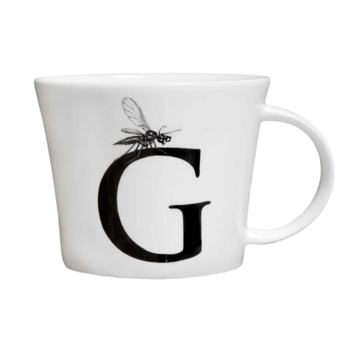 G letter with gnat sitting on top of the letter in ink design on white fine bone china mug