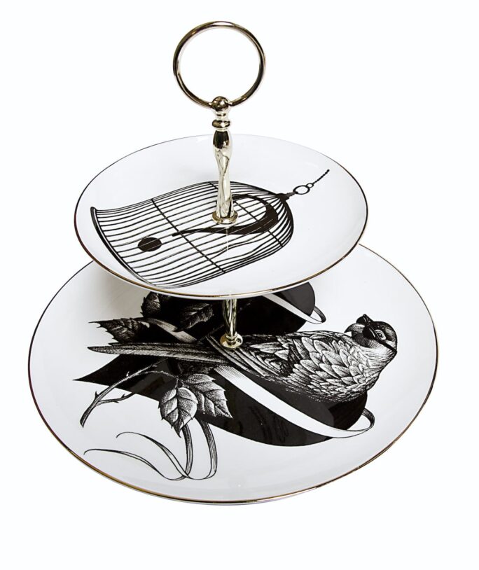 Bird sitting on the heart on one plate and cage with question mark on the other plate made from white bone china cake stand with 22 carat detailing