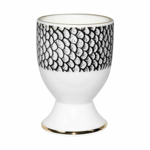 scale in ink design around white fine bone china egg cup in 22 carat detailing
