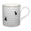 Buzzing Bee Mug by Rory Dobner covered in a fading honeycomb and buzzing bee design, with a 22 carat gold rim and detail on the handle