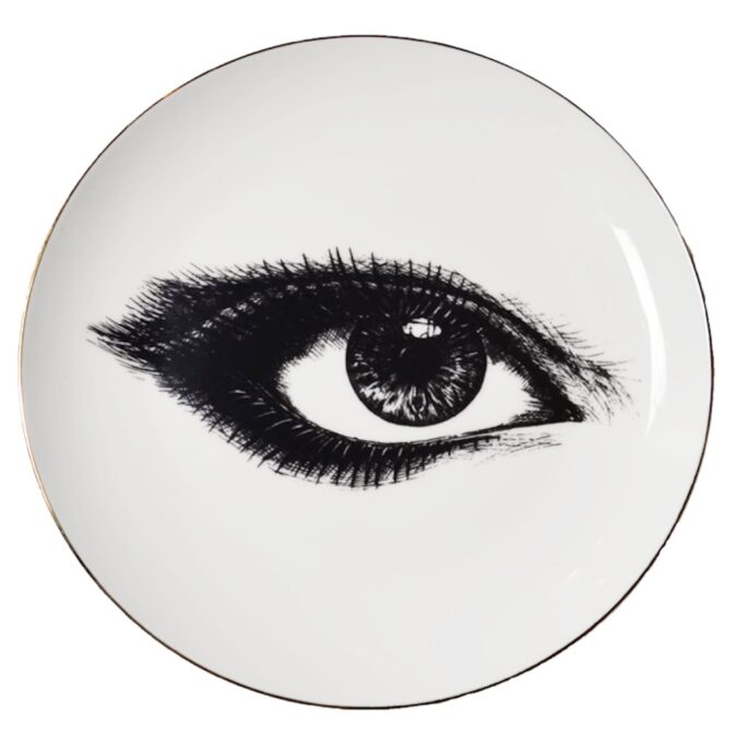 left eye looking at you across white fine bone china plate