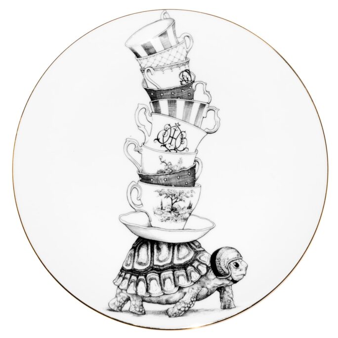 Female tortoise balancing multiple teacups on her shell