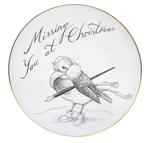 Black and white italic writing saying Missing You at Christmas with a robin holding a quill.