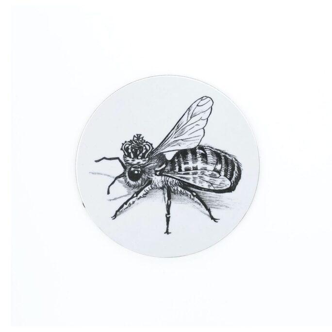 Queen Bee wearing crown in ink design on melamine coaster.