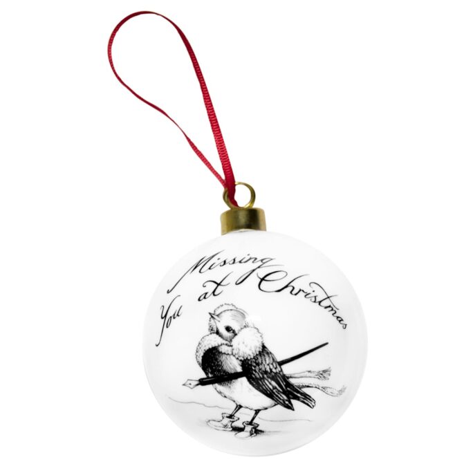Bird with the writing on top "missing you at Christmas" in ink design on white fine bone china bauble